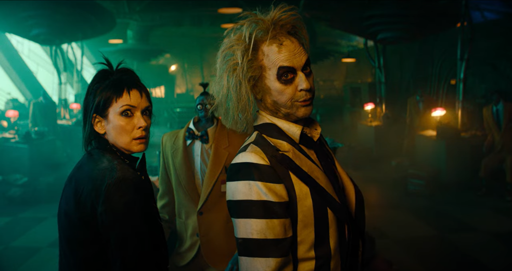 Why does Beetlejuice want to return to the land of the living, and what motivates his new plan in Beetlejuice 2?